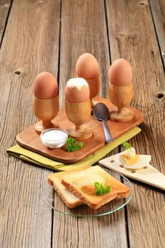 Deviled eggs on wooden stand with toast Stock Photos