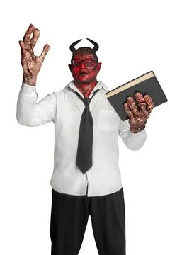 Devilman is standing and holding the book Stock Photos