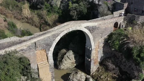 The Devil's Bridge and the Abbadia Castle in Vulci, Canino, Viterbo Stock Footage 149077777