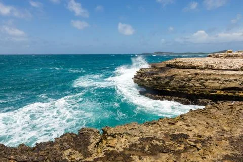 Devil's bridge antigua waves crashing on coastline Stock Photos