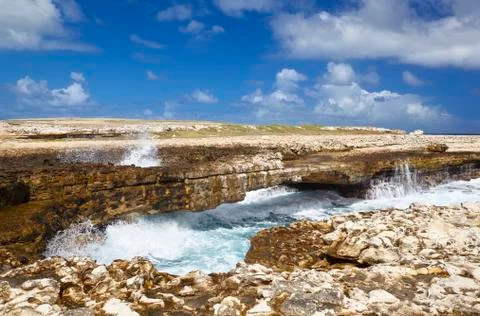 Devils Bridge in the northeast of Antigua where the waves of the Atlantic hav Stock Photos