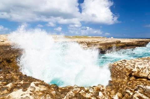 Devils Bridge in the northeast of Antigua where the waves of the Atlantic hav Stock Photos