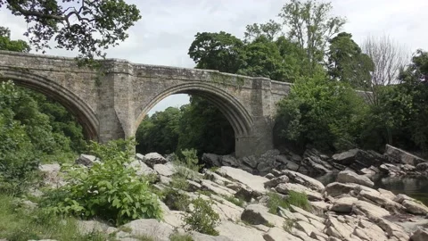 Devils Bridge old stone over River Lune Stock Footage 238029005