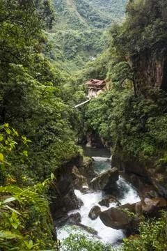 Devil's Cauldron waterfall - Mountain river and fall in the Andes. Banos. Ecu Stock Photos