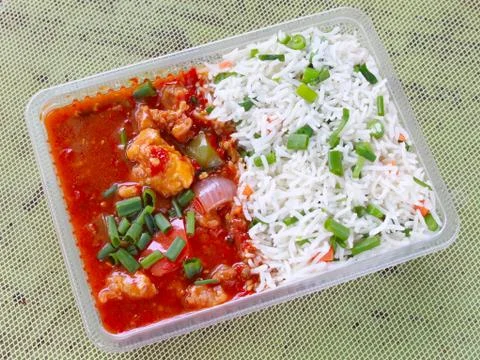 Devil's chicken with rice combo takeaway Stock Photos