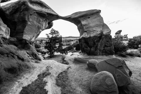 Devils Garden at Sunset Metate Arch Black and White Stock Photos