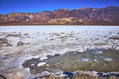 Devil's Golf Course Salt Flats and Colorful Mountains in Death Valley Calif.. Stock Photos