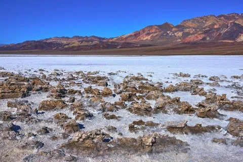 Devil's Golf Course Salt Formations and Colorful Mountains in Death Valley .. Stock Photos