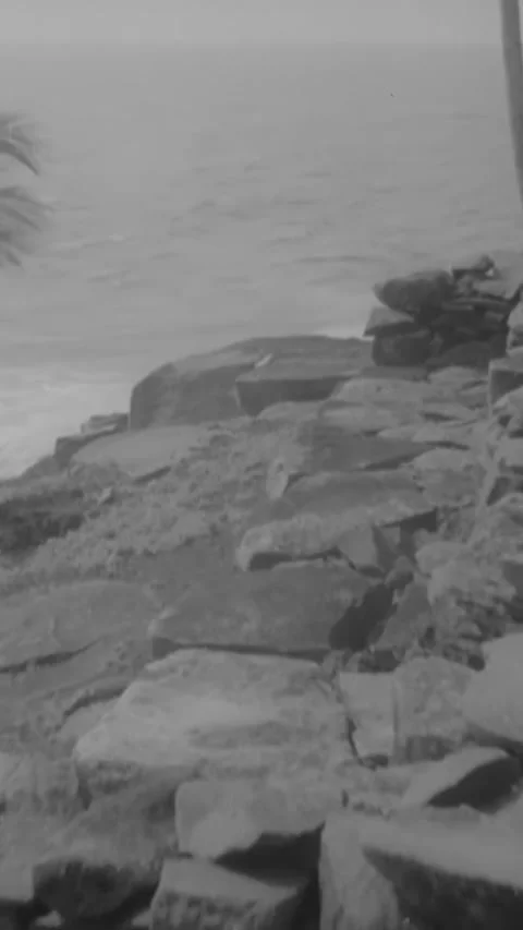 DEVIL'S ISLAND - 1939 - Prison guards get water from a well and visit a cemetery Stock-Footage 342269411