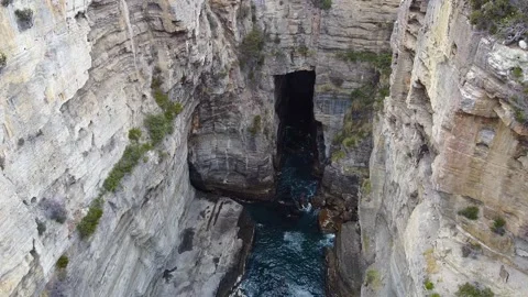 Devil's Kitchen, located in Tasmania, is a mesmerizing geological wonder Stock Footage 274872480