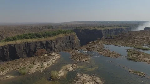 Devils Pool and the landscape around above Victoria Falls, aerial shot Stock Footage 97387961