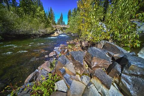 Devils Postpile Basalt Columns River and Wooden Bridge in Lush California Forest Stock Photos