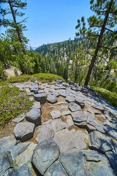 Devils Postpile Basalt Rock Formations with Pine Forest and Sierra Nevada Hills 写真素材