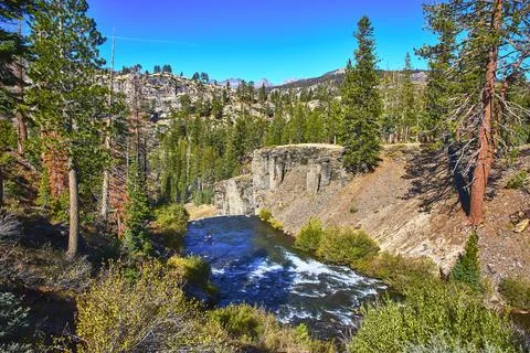 Devils Postpile River Canyon and Pine Forest under Clear Blue Sky in California Stock Photos