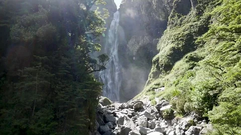Devil's Punchbowl waterfall in Arthur's Pass Nationalpark, New Zealand - sun Stock Footage 92923694