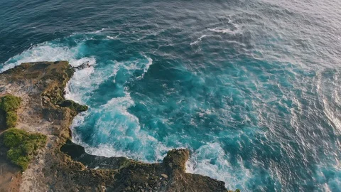 Devil's tears cliffs and blue waves at Nusa Lembongan island, Indonesia. Filmed Stock Footage 123859063