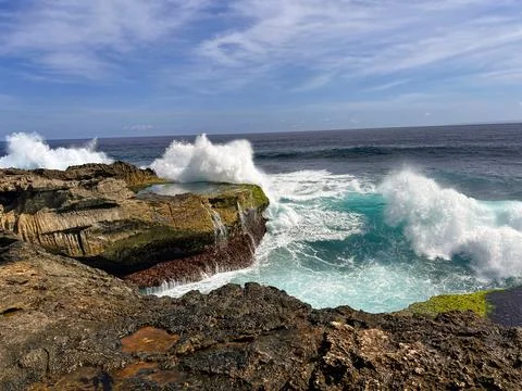 Devils Tears Waves Crashing Against Cliffs on a Sunny Day, Nusa Lembongan Stock Photos