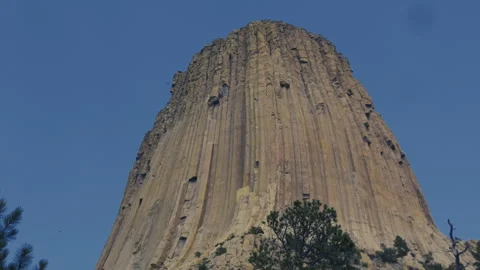 Devils Tower Columned Rock Face Against Clear Blue Sky Stock Footage 340245992