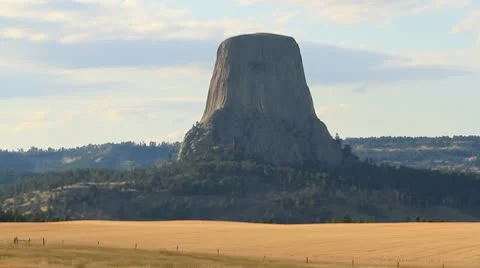 Devils Tower with golden fields in foreground Video stock 8848566
