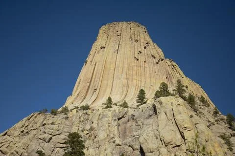Devils Tower National Monument Against A Deep Blue Sky In Wyoming Stock Photos