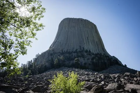 Devils Tower National Monument under a clear blue sky, Wyoming, USA Stock Photos