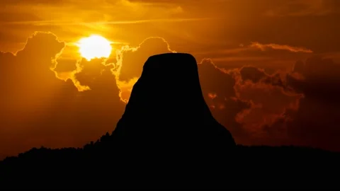 Devils Tower: Time Lapse at Sunset with Red Sun and Fiery Sky, Wyoming, USA Stock Footage 220096112