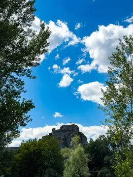Devin Castle framed by trees and blue sky. Distant stone ruins sit on a roc.. Stock Photos