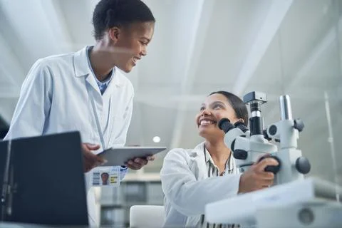 Devising, formulating and executing a new test together. two scientists working Stock Photos