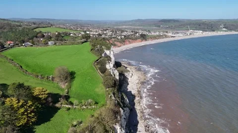 Devon Coast near Seaton England Panning drone aerial 4K footage sunny day Stock Footage 333393267