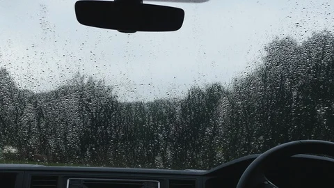 Devon England 21st July 2018 Rain falling on camper windscreen Stock Footage 129759214