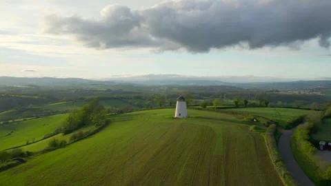 Devon Windmill over fields and farms from a drone, Torquay, Devon, England Stock Footage 240659857
