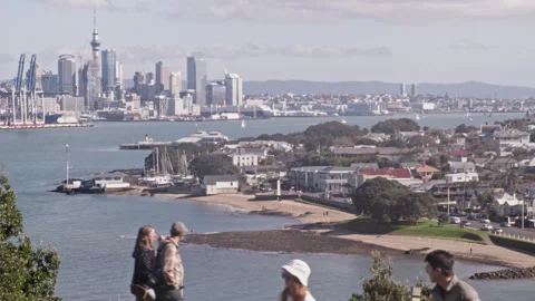 Devonport beach, looking across the channel to Auckland City Stock Footage 247473552