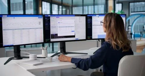 DevOps Engineer Carefully Monitors Continuous Integration Pipeline On Desktop Stock Photos