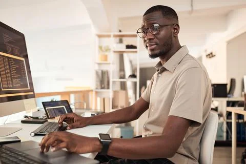 Devops Engineer Examining Programming Code 스톡 사진