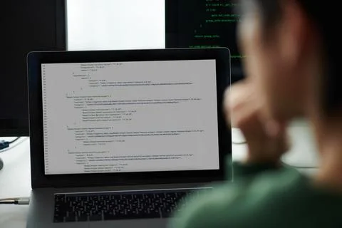 Devops Engineer Looking at Code Stock Photos