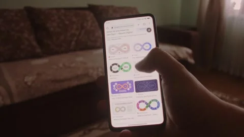DevOps. Searching information about DevOps on mobile phone screen. Stock Footage 249819352