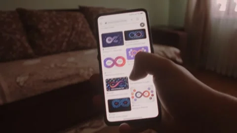 DevOps. Searching information about DevOps on mobile phone screen. Stock Footage 249819445