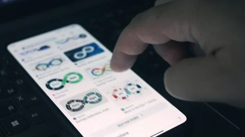 DevOps. Searching information about DevOps on mobile phone screen. Stock Footage 249820301