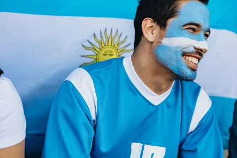 Devoted Argentina soccer fan in stadium Stock Photos