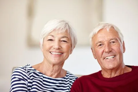 Devoted to each other. Portrait of a loving senior couple at home. Stock Photos