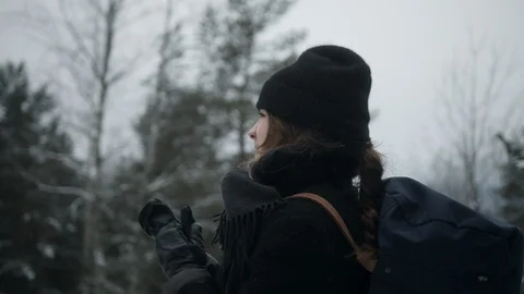 Devoted hiker freezing and rubbing hands on her challenging forest journey alone Stock Footage 122180513