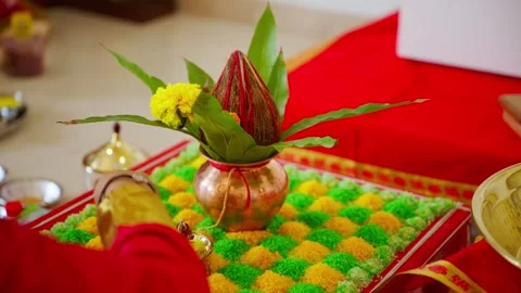 Devotee arranges garland at adorned shrine Stock Footage 303126098