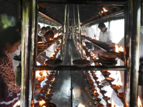Devotee burning incense Stock Photos