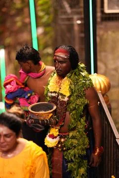 A devotee carries ritual hot pan Stock Photos