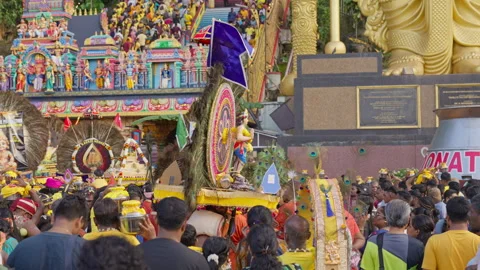 Devotee carrying kavadi dancing around before the Batu Cave stairs, Malaysia Video stock 271586469