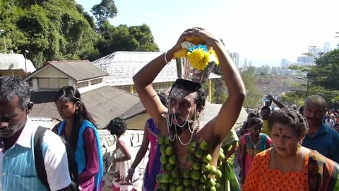 A devotee carrying pot of cows milk as offering, Thaipusam Festival, Malaysia Stock Footage 277611841