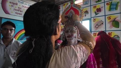 Devotee dressing as Lakshmi in a school for Charak Puja, Kamalganj, Bangladesh Stock Footage 310758354