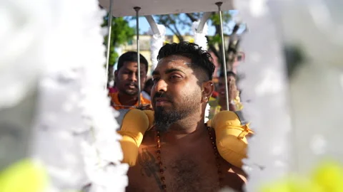 The devotee has secured a kavadi onto their body during the Thaipusam festival. Stock Footage 234042131