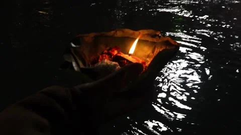 Devotee holding aarti flower pot for ganges river evening prayer at night Video stock 191416907