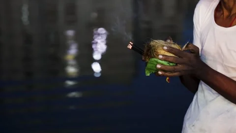 Devotee Holding Coconut And Incense During Chhath Puja Evening Prayer By Rive Stock Footage 340890109